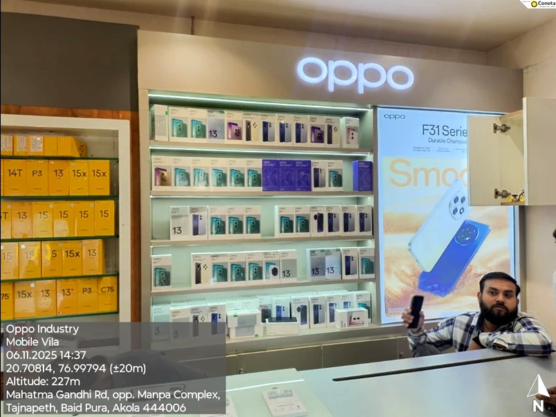 After — OPPO in-shop display wall with backlit logo and shelving, Mobile Vila, Akola